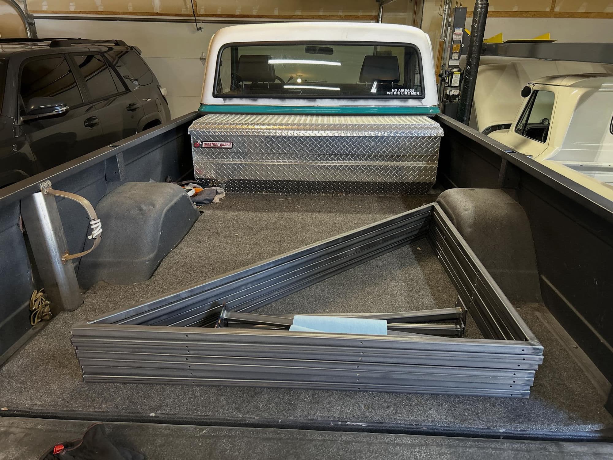 Custom bed fabrication — diamond plate toolbox and welded frame